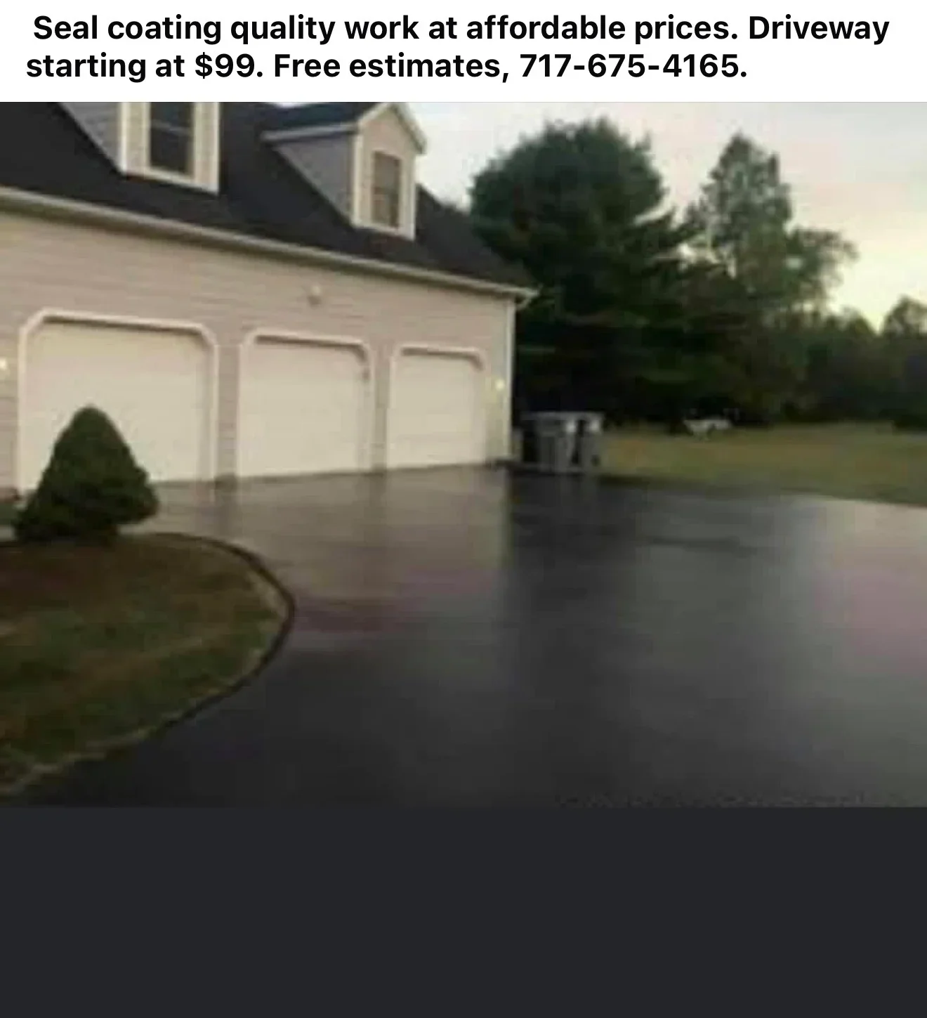 Freshly seal-coated residential asphalt driveway with dark protective finish
